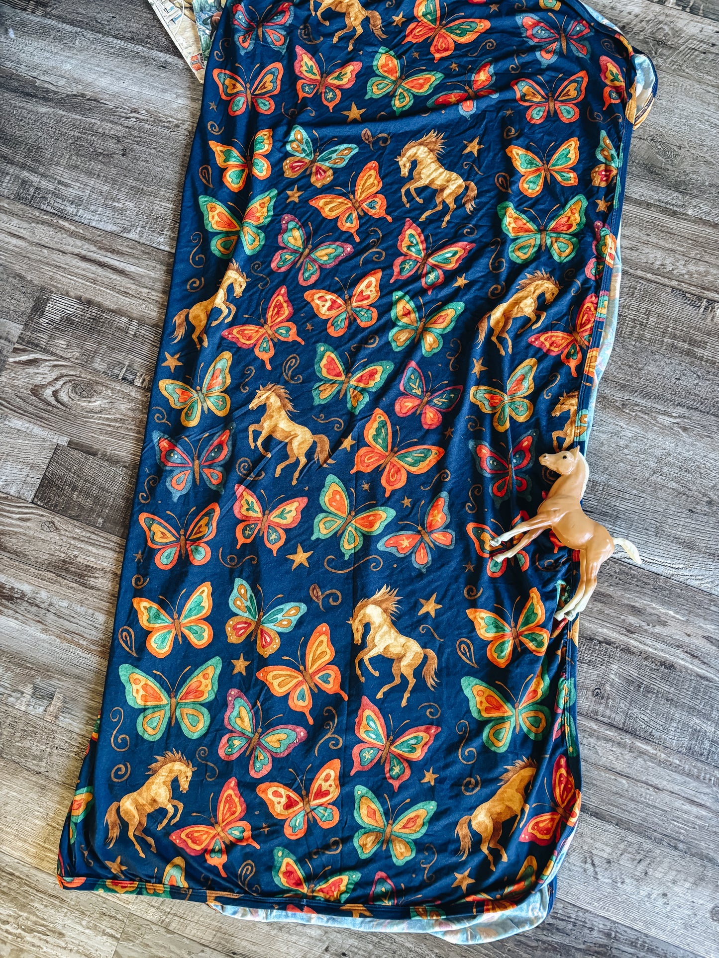 The Butterfly Bronc Swaddle Blanket